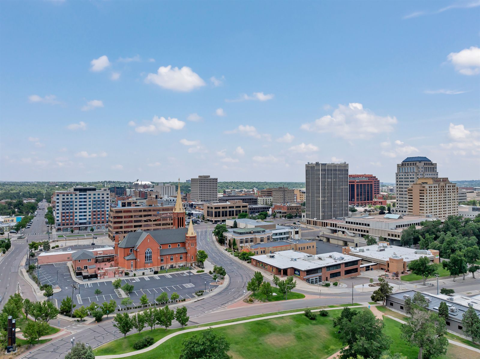 Aerial view of downtown Colorado Springs rooftops and neighborhoods served by Fixins Roofing