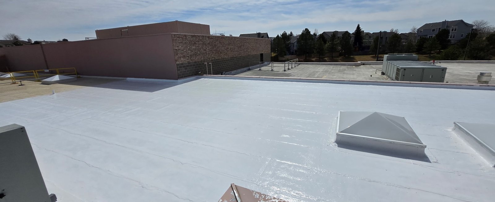 Freshly coated white membrane roof at the Briargate YMCA extending building life and cutting cooling costs