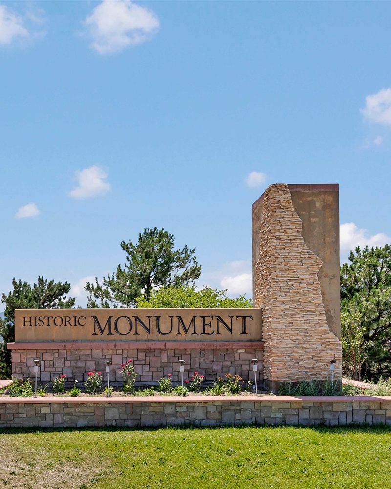 The Historic Monument entrance sign and stone pillar in Monument, Colorado