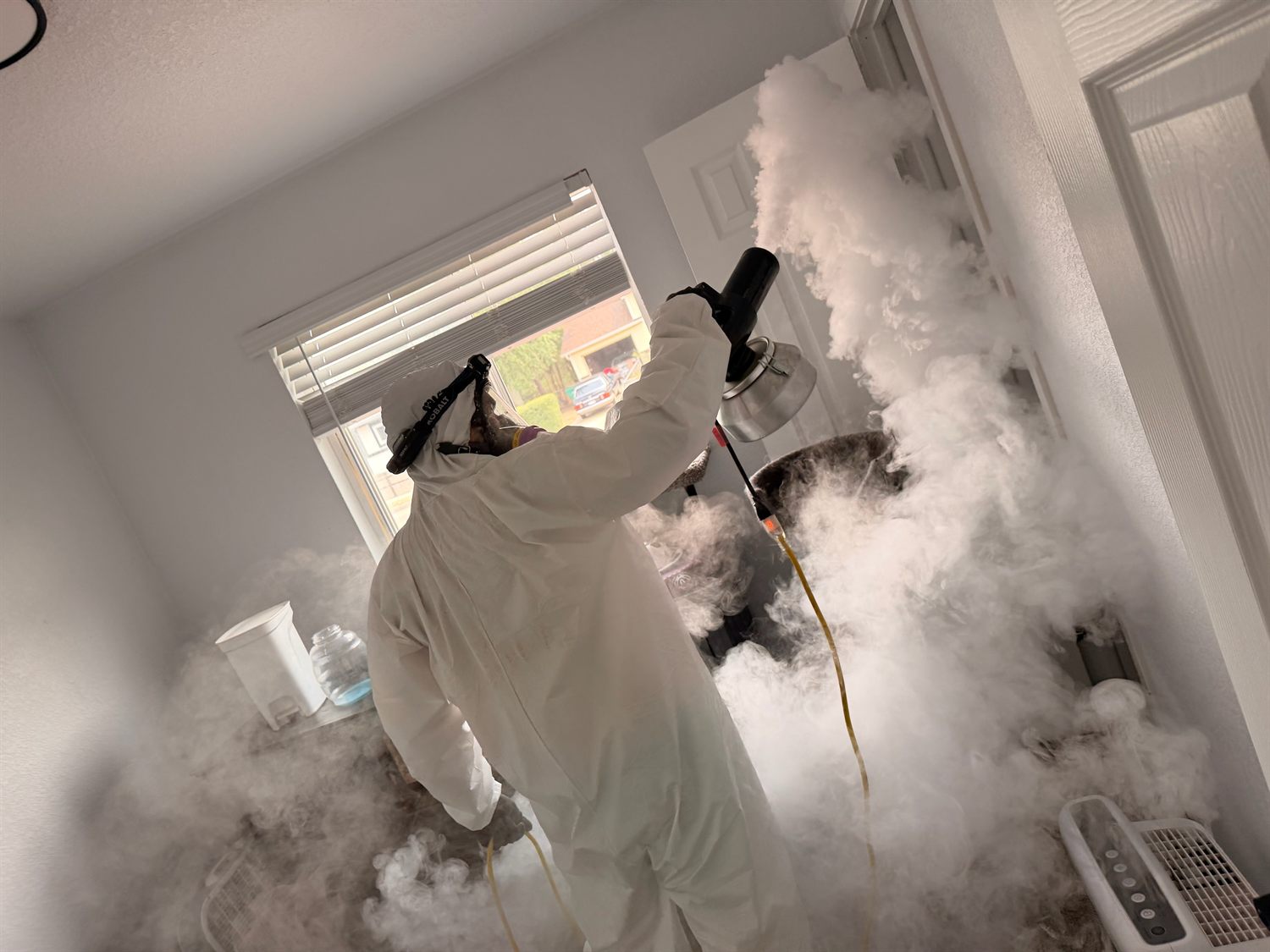 Fixins technician thermal fogging a property to neutralize odors in Colorado Springs