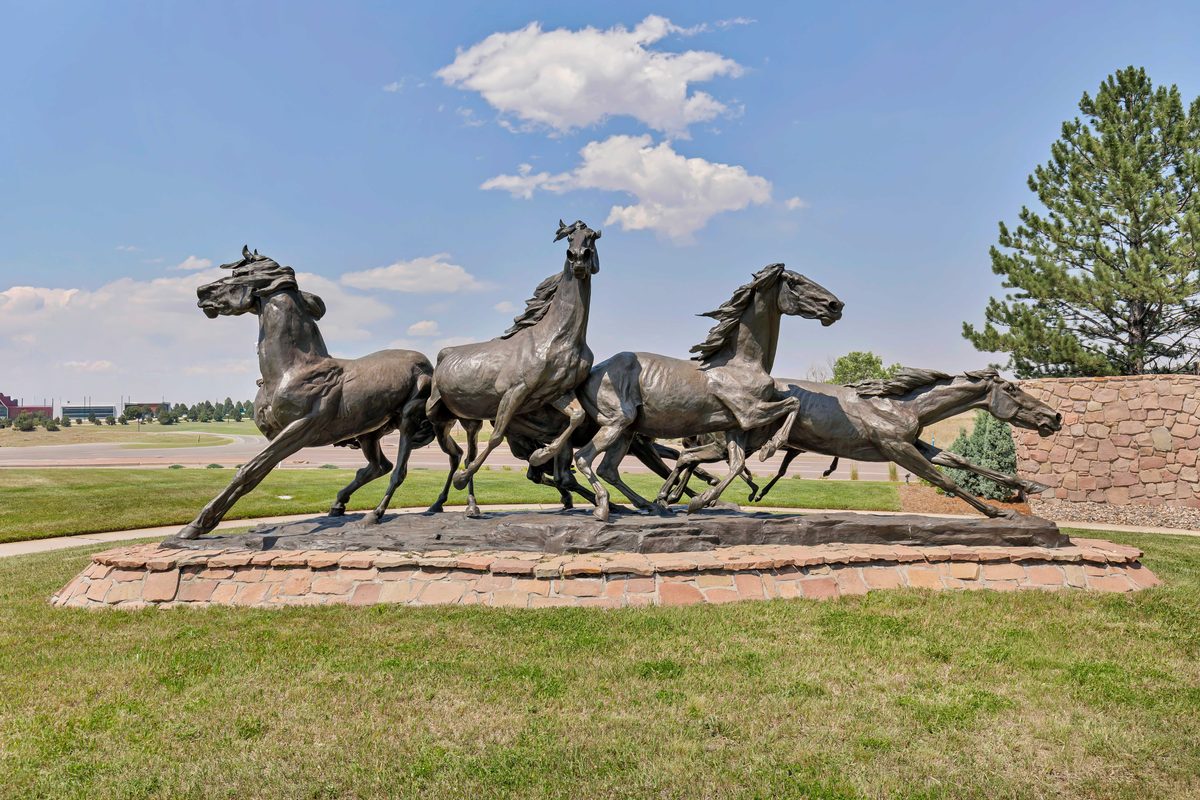 The running horses sculpture at the Briargate entrance in Colorado Springs