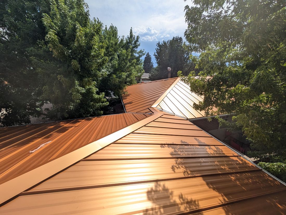 Aerial view of completed standing seam metal roof installation in Colorado Springs