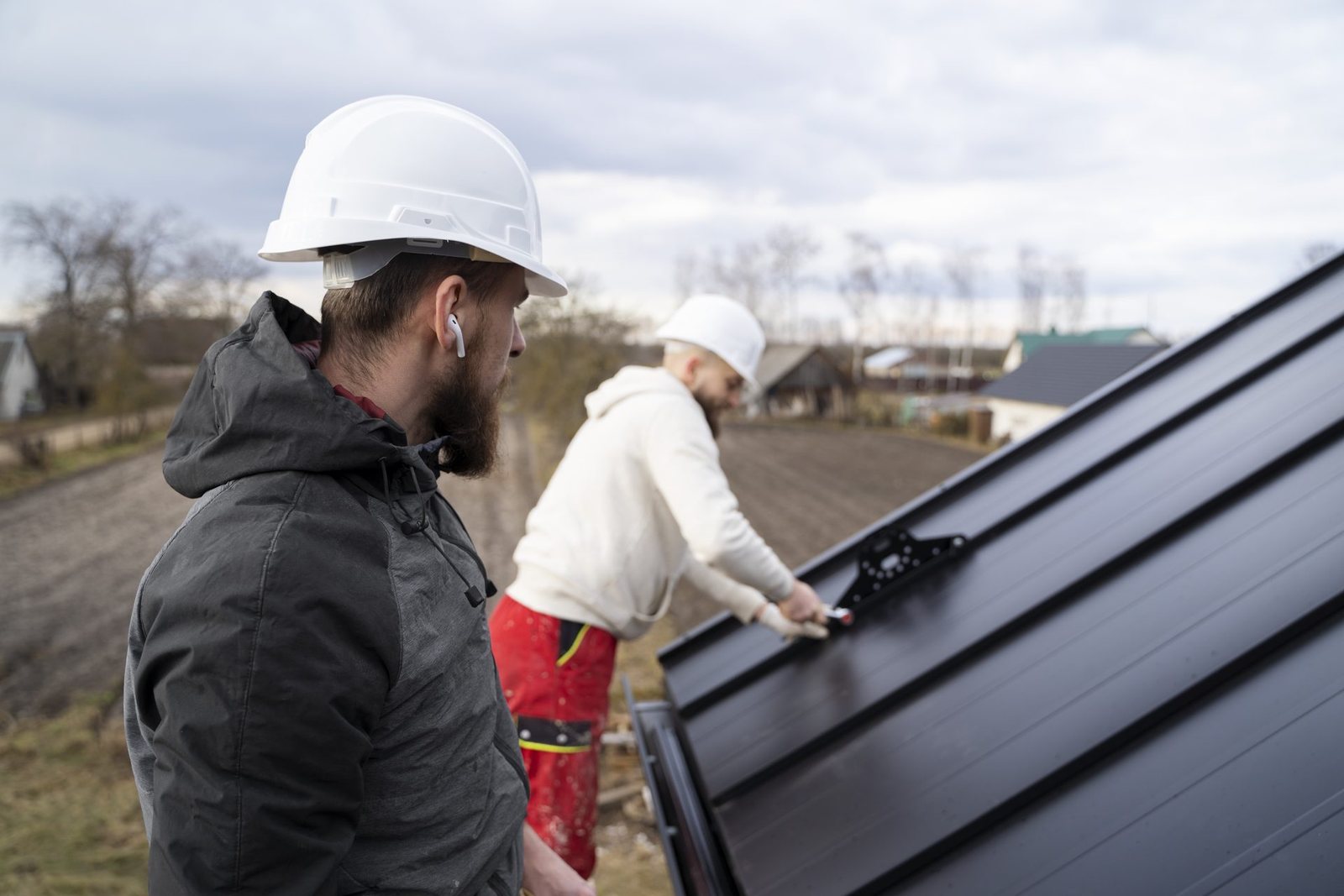 Fixins crew installing a standing seam metal roof in Colorado Springs
