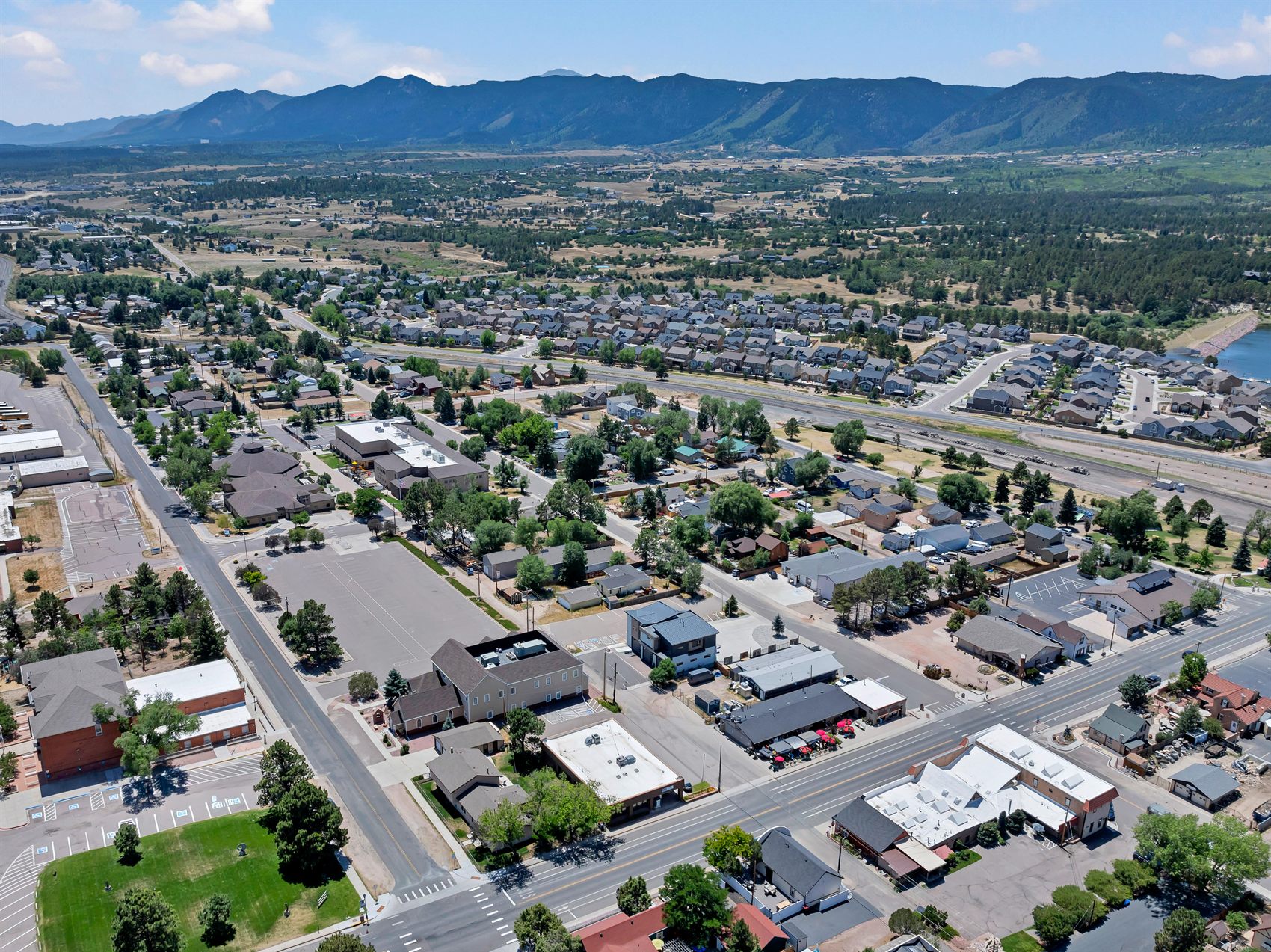 Aerial view of downtown Monument, Colorado, with the Front Range beyond