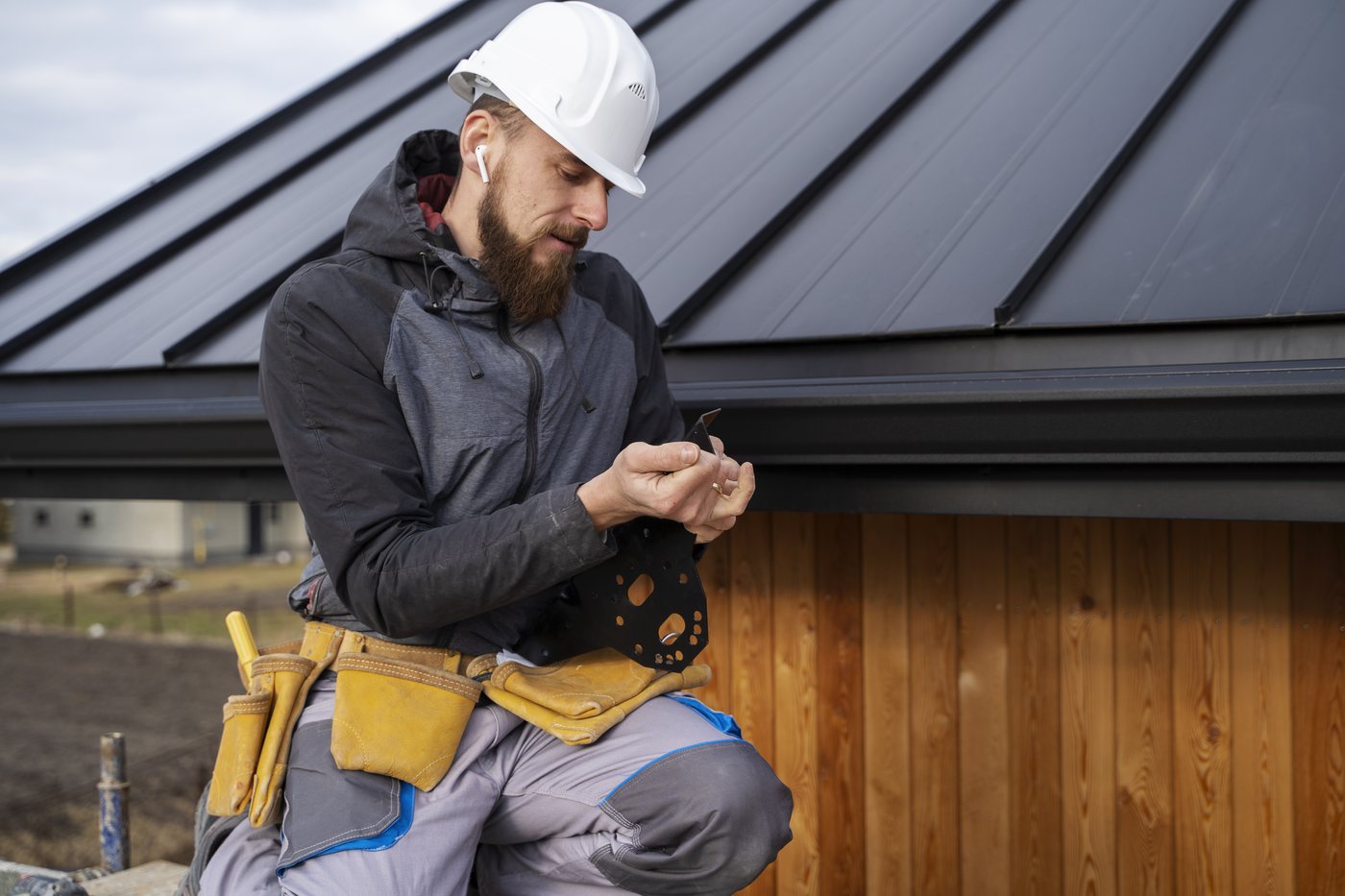 Fixins roofer preparing components during a residential roof installation in Colorado Springs