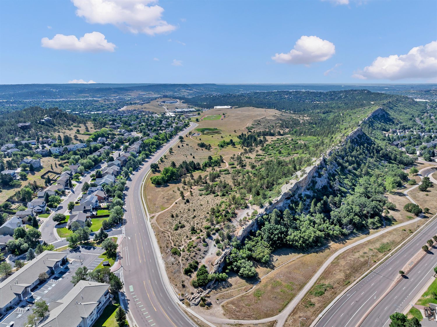 Aerial view of Rockrimmon in Colorado Springs, with its sandstone bluff and open space alongside the neighborhood