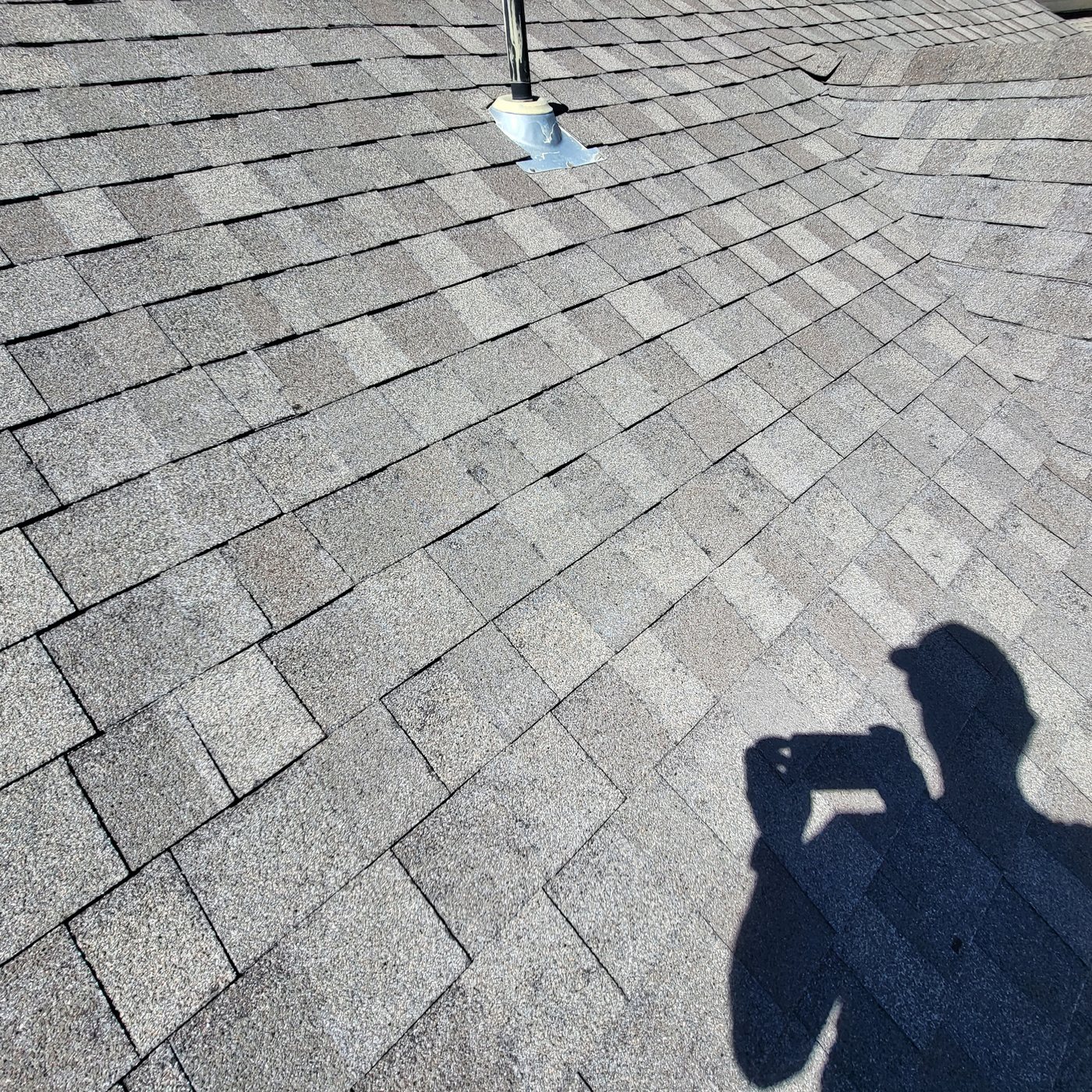 Fixins inspector assessing a roof for hail and storm damage in Colorado Springs