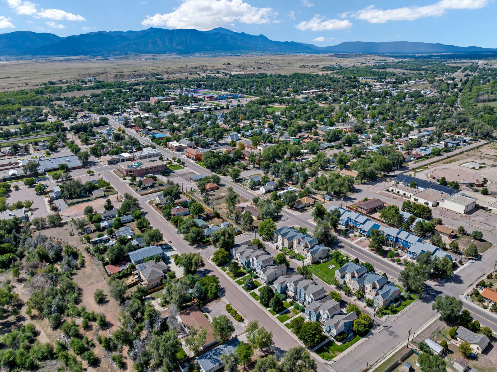 Aerial view of newer homes and the downtown corridor in Fountain, Colorado south of Colorado Springs