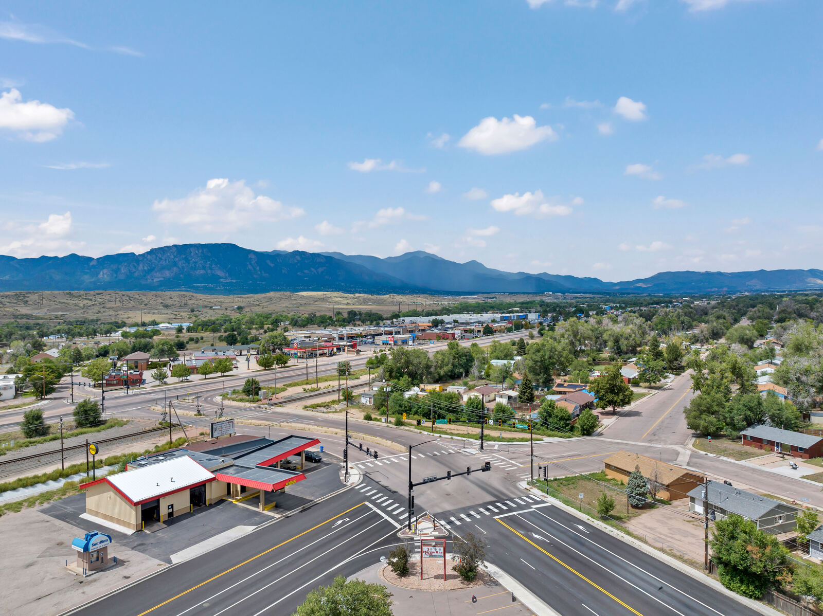 Aerial view of the Security-Widefield commercial corridor in south Colorado Springs with the Front Range mountains beyond